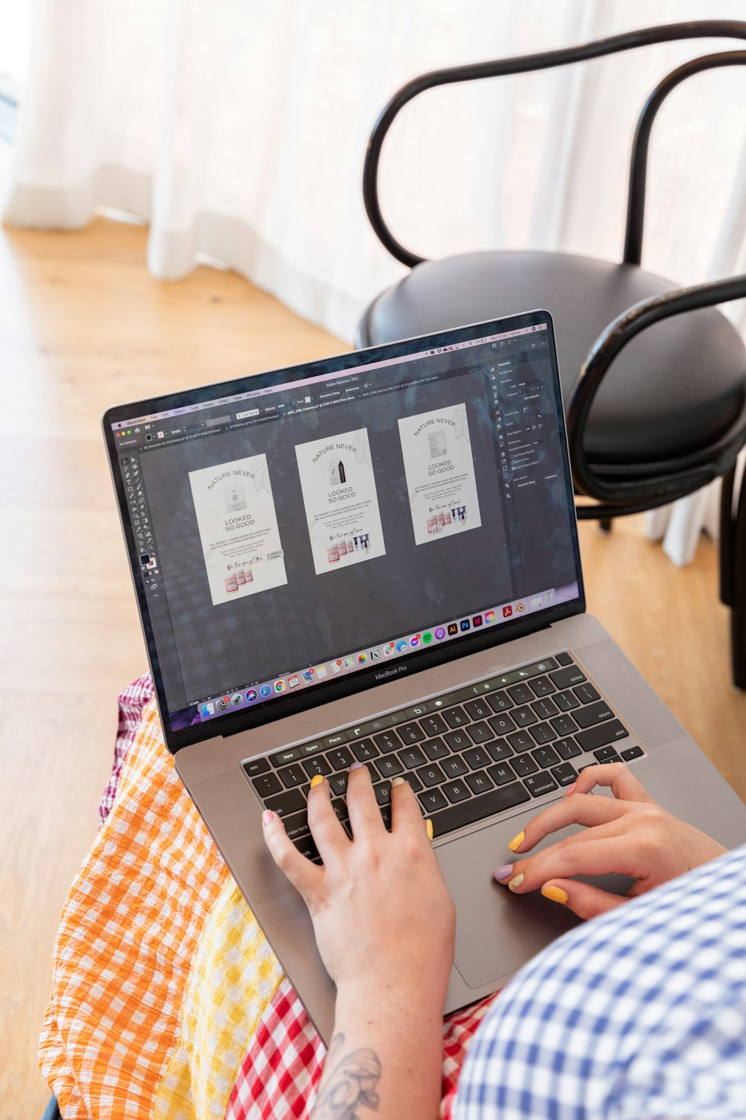 a-person-sitting-in-a-chair-using-a-laptop-computer-y-9mibp3oku